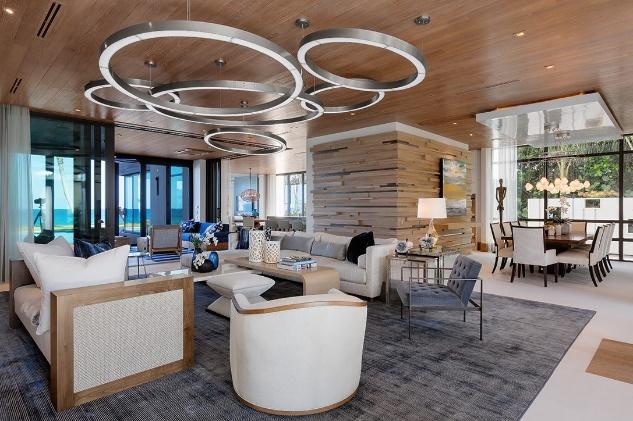 Luxury Modern Living Room Interior Design with circular art fixture and wood paneling