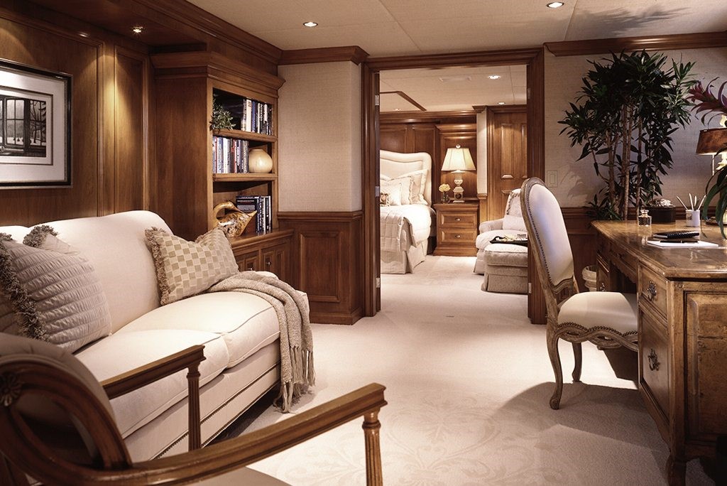 luxury yacht interior design wood paneled living and sleeping quarters