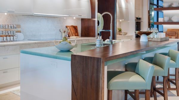 luxury kitchen island with pops of tiel