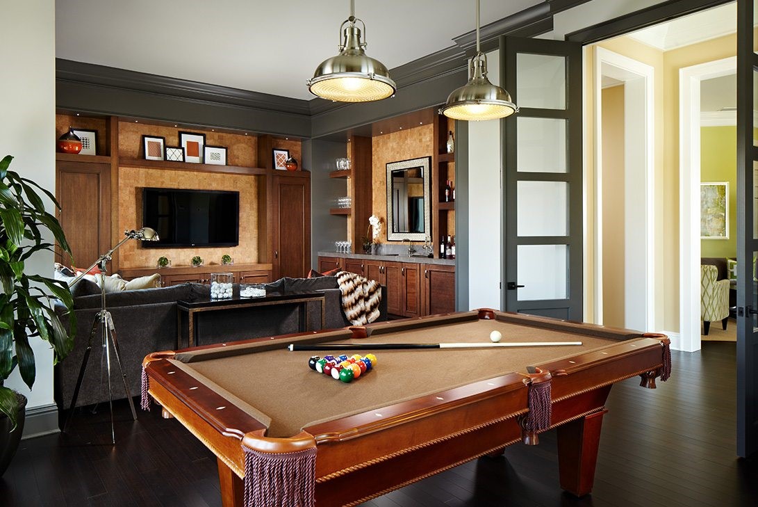 brown billiards table luxury game room with smart home lighting