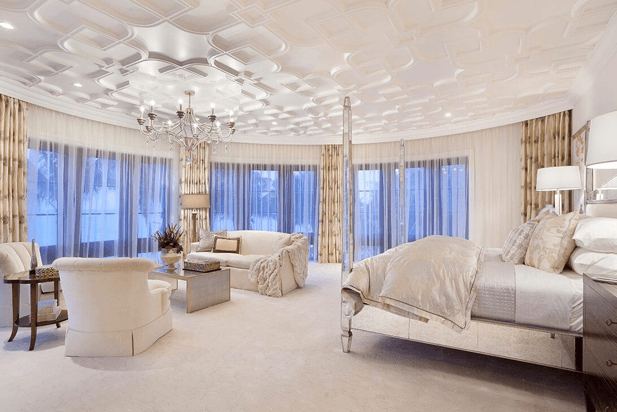 An elegant luxury hotel room with a silver chandelier.