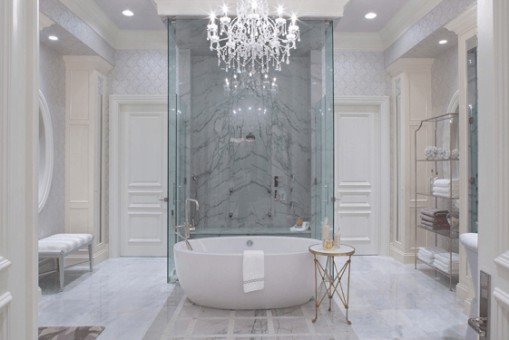 Luxury bathroom with smart lighting chandelier over a bathtub.