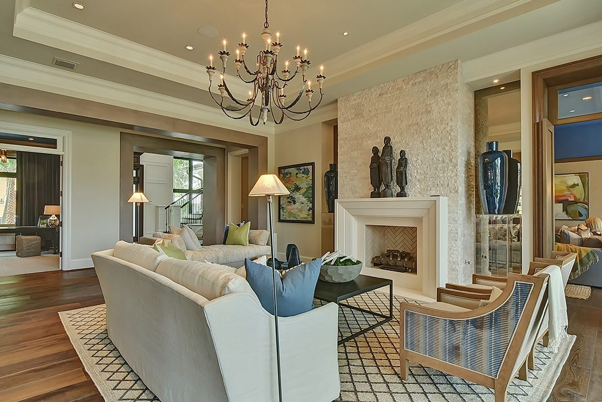 Transitional Design living room with a fireplace and chandelier.