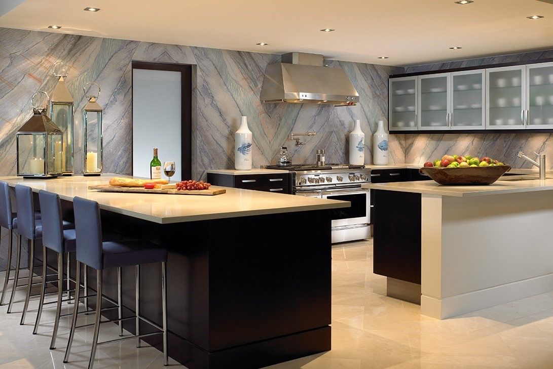 Modern luxury kitchen with a multifunctional island and seating.