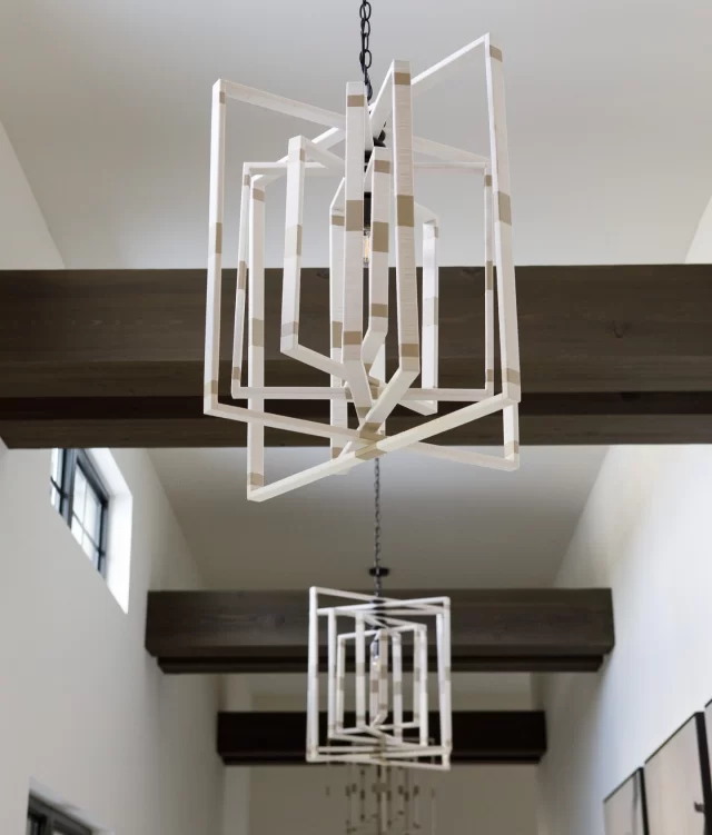 Look Up 💡 These chandeliers by @m2cstudio are wrapped in rayon and metallic thread, adding fun texture to this ranch hallway. #ranchlife #ranchhome #pinecreeksportingclub