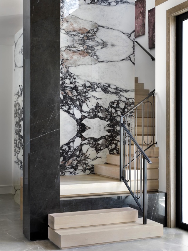 A seamless dialogue between downstairs and upstairs - design in motion #interiordesign #downstairs #upstairs #luxurydesign #staircasedesign #jupiterfl #luxuryhomes #marblestairs #bearsclub