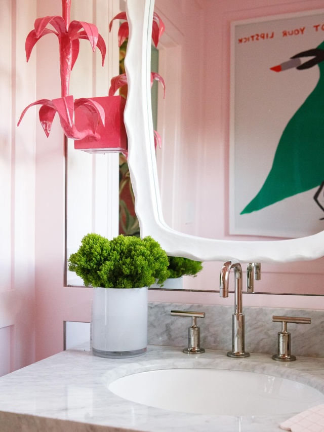 Poise and personality. The gracefully ascending sconce stems are adorned with three tiers of blooms entirely hand crafted from papier mache over iron tubing. #powderbath #bathroomdesign #oceanridge #colorpop #interiordesign