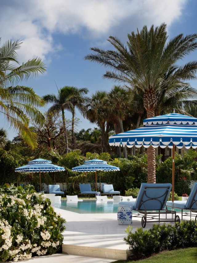 Marc-Michaels’ attention to detail is seen also in the furnishing of the two pool areas, one in front of the house, the other at the rear. They preserved a pair of existing banyan trees that tower over the front pool, while at the rear, they designed a semi-circular bench centered with a firepit. “The homeowners and guests like to nestle there. It’s one of several destination points in the yard.“ #outdoorliving #pooldesign #palmbeach #luxuryhomes #luxuryliving