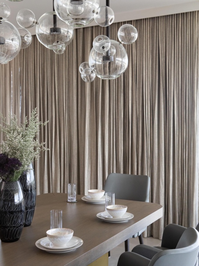 The power of drapery in a luxury condominium. Featuring foiled linen sheers by @zinctextile of The Romo Group @romo_fabrics