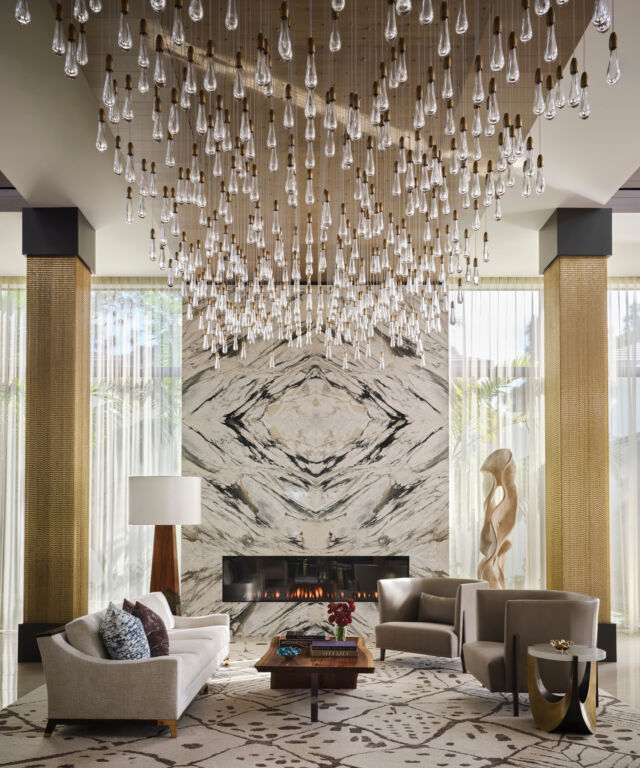 Stone, brass, walnut, glass, and texture — no single material tells the story. Together, they make the room. That's the Marc-Michaels mix: forty years of spaces where every layer has something to say, from the ground beneath your feet to the light overhead.